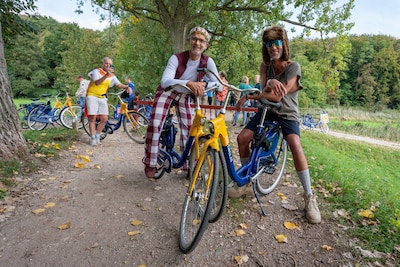 Ruim vijftig mensen rijden met een OV-fiets een flinke klim tijdens het NK: ‘Dit is toch iconisch?’