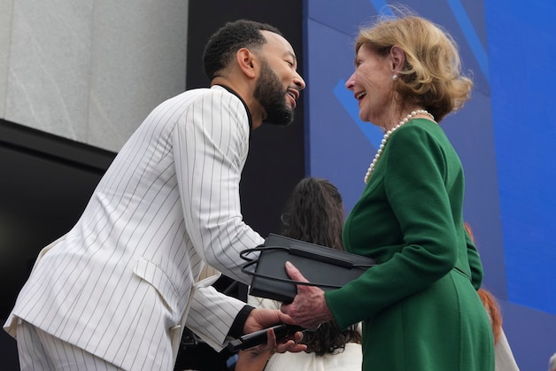 John Legend and Laura Bush.